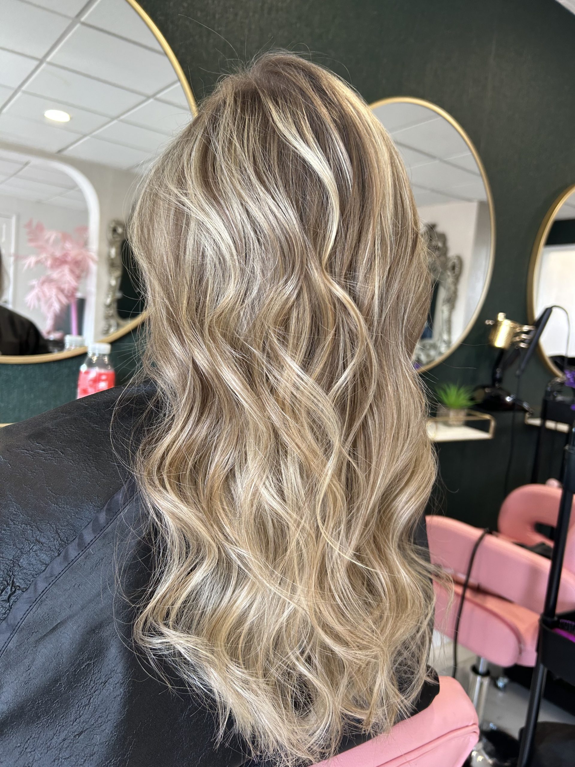 Closeup Of A Strand Of Female Hair On A Special Sheet Of Foil The Master  Applies Hair Dye With A Brush The Process Of Highlighting By A Professional  Master In A Beauty